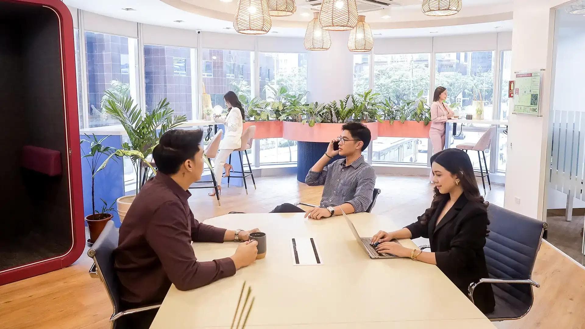 Employees working at a KMC Coworking Space