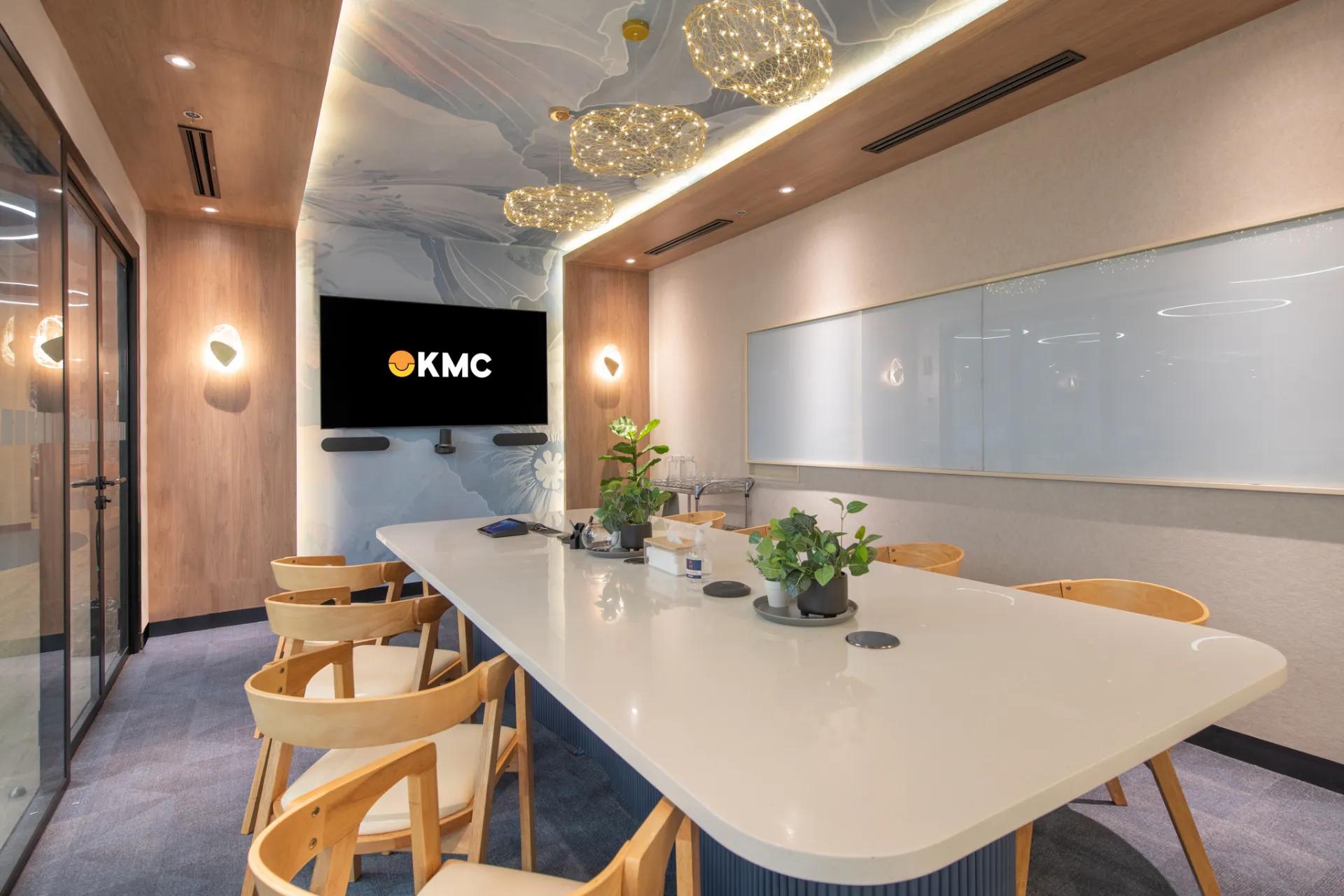 Office space in Makati with wooden chairs, a white marble table, warm lighting, soft wall decor, and glass panels. Office space in Makati with wooden chairs, a white marble table, warm lighting, soft wall decor, and glass panels.