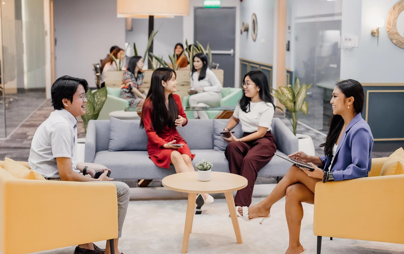 Professionals collaborating in a KMC office lounge, emphasizing teamwork and offshore staffing solutions. Professionals collaborating in a KMC office lounge, emphasizing teamwork and offshore staffing solutions.