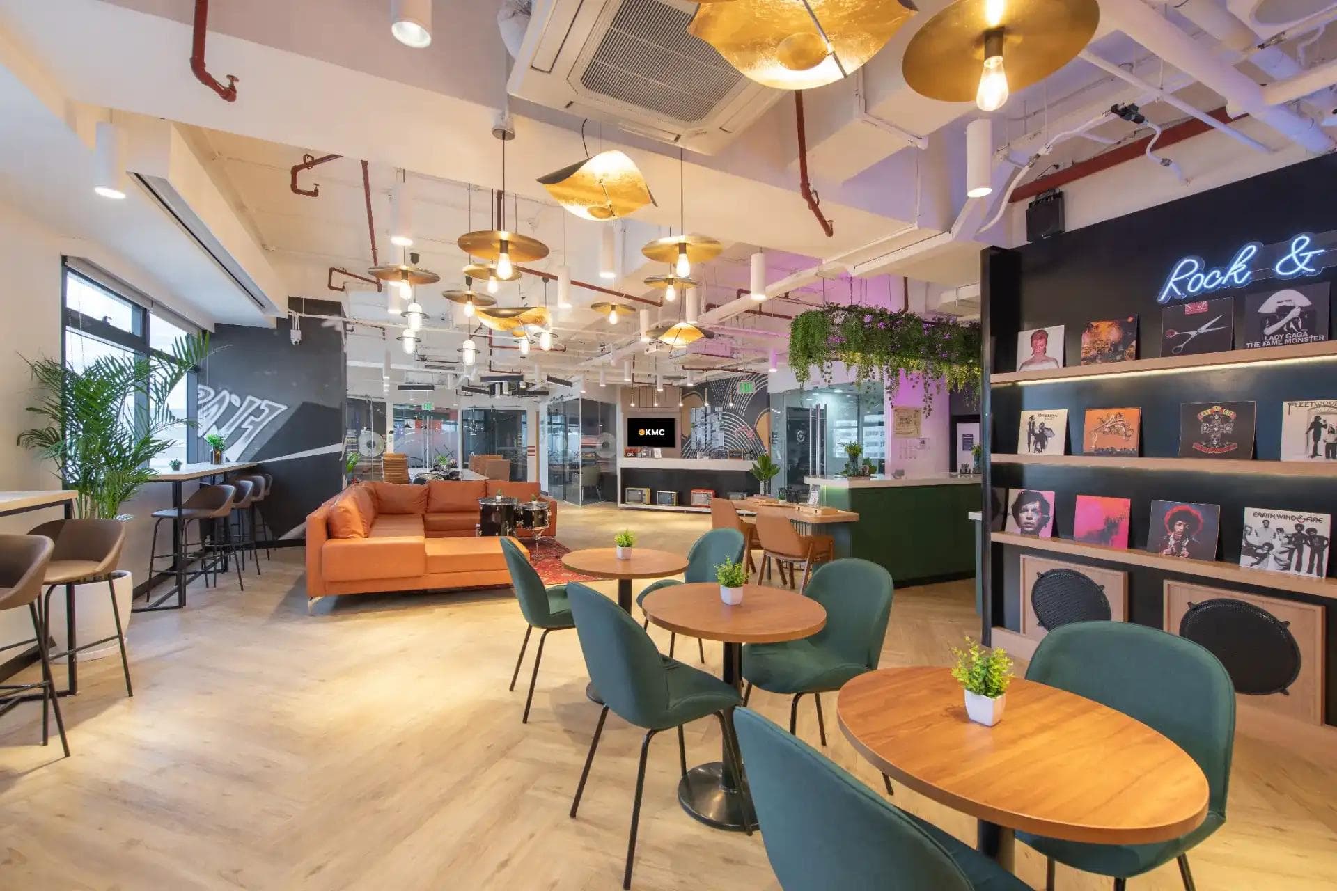 A vibrant and modern proworking space in Ortigas featuring open seating, sleek meeting tables, greenery, and creative decor.